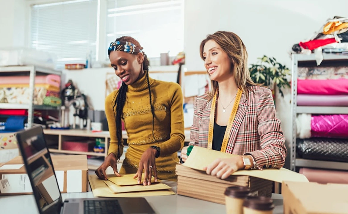 Two women working in a small shop