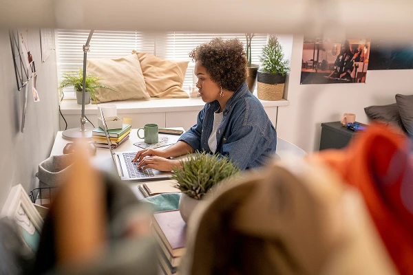 Woman working on a laptop at home