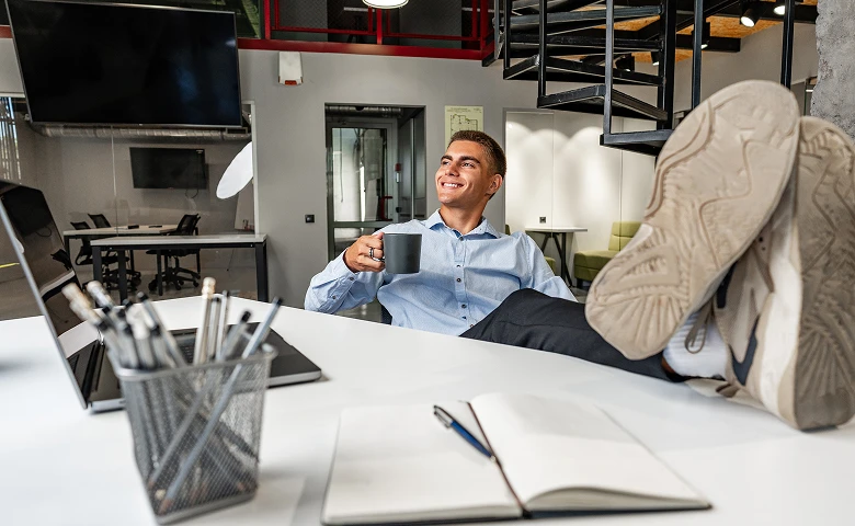 Man relaxing at his desk