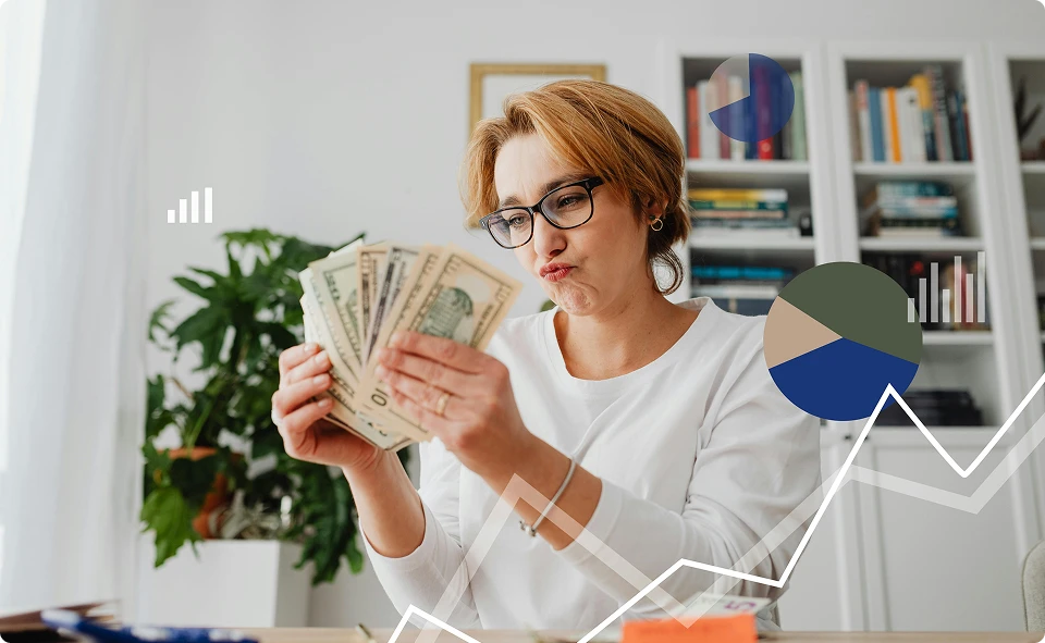 Woman smiling with cash in her hands