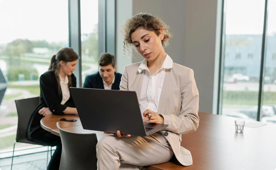 Two women looking at a laptop together